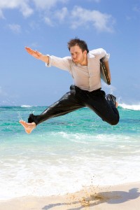 business man jumping through the ocean..