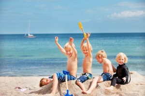 3 kids playing on the beach